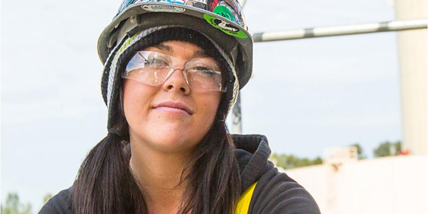 Woman wearing safety glasses and hard hat