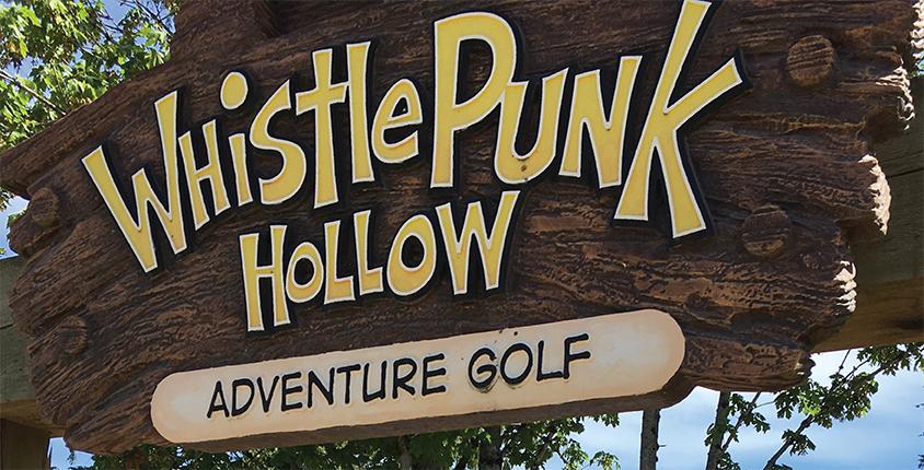 Sign that reads Whistle Punk Hollow Adventure Golf