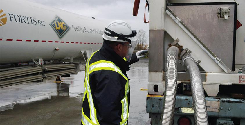 Man watches an LNG fuelling pump