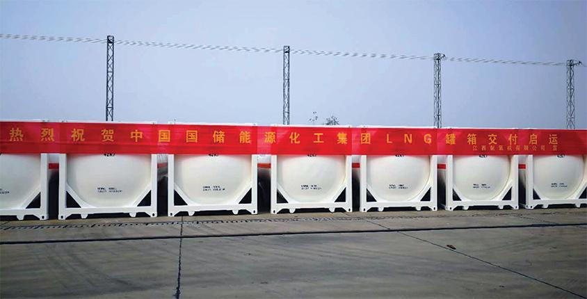 Line of ISO tanks of LNG with a red banner across the top of them