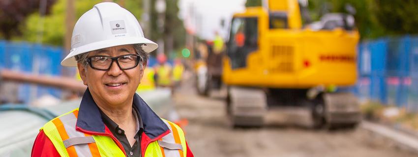 Art Kanzaki of FortisBC stands on the gas line route