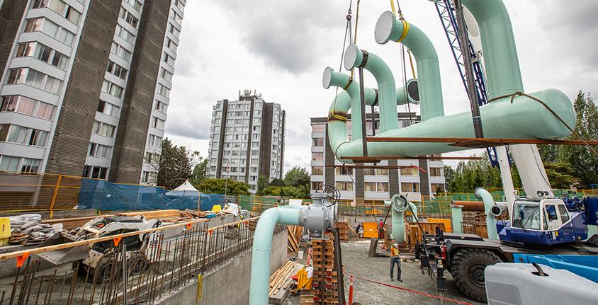 pipes are picked up by a crane