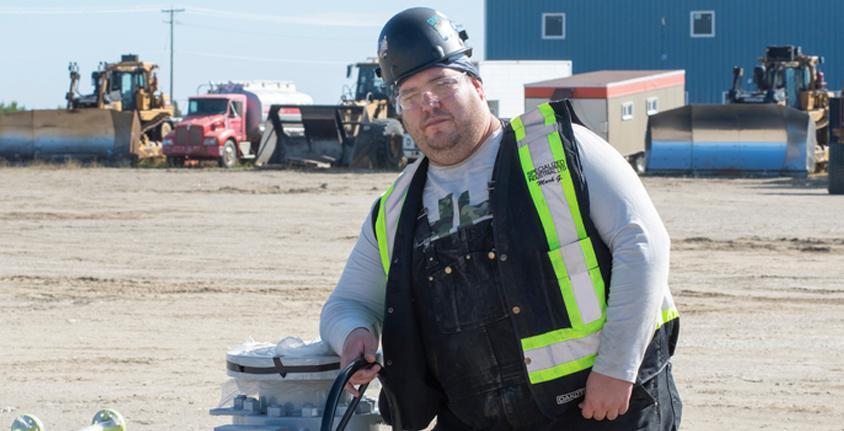Mark Gustitus, a student in the PGNAETA Piping Foundations program gains experience at an active FortisBC job site in Mackenzie, BC.