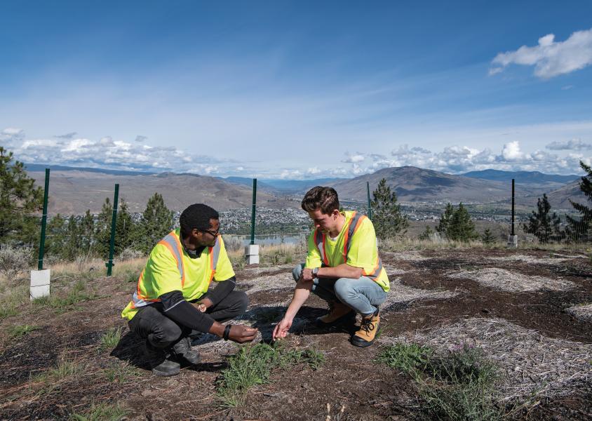 Dr. Moro Fajiye and master’s student Nate Dungey check on the native plants in Kenna Cartwright park