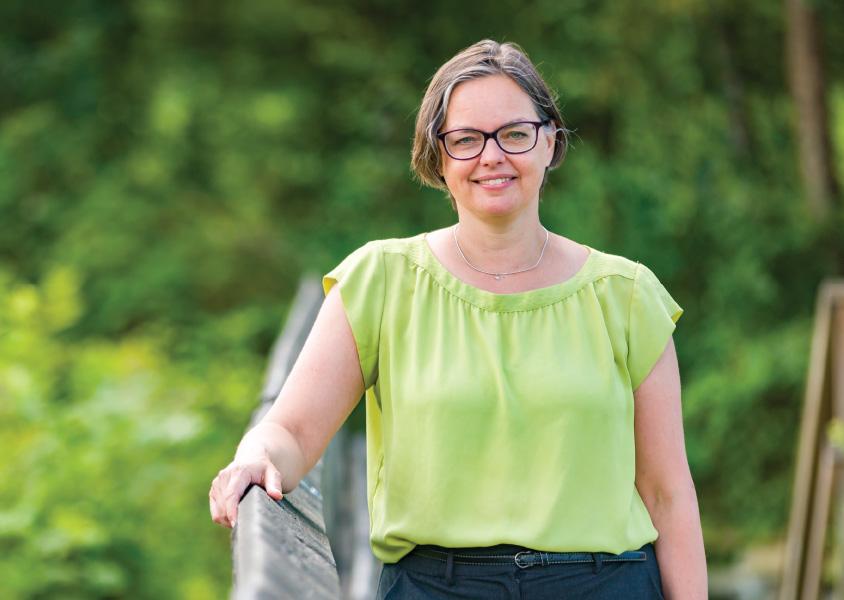 Linda Bakker stands along a bridge in Burnaby Lake Park