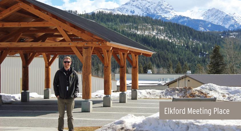 A man stands in front of the Elkford Meeting Place