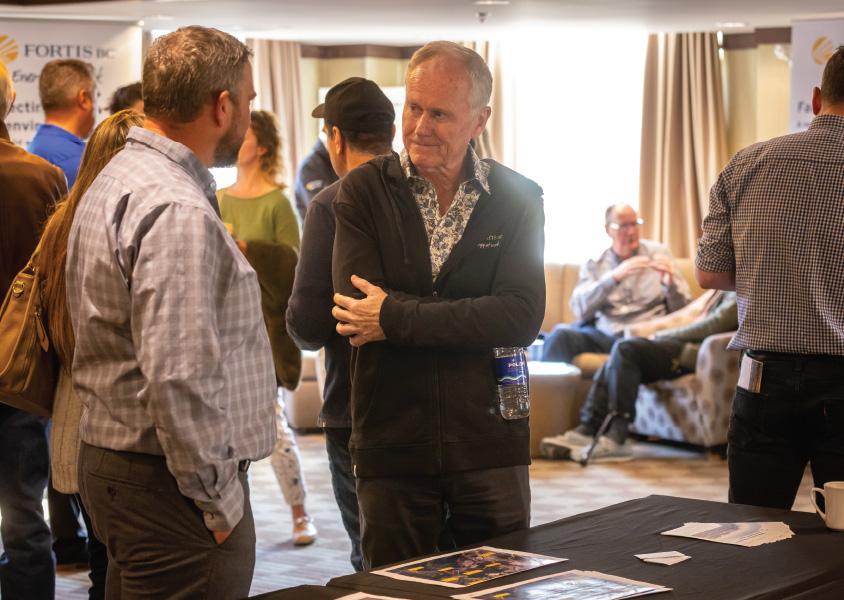 Gord from FortisBC talks to guests at an EGP open house in Squamish. 