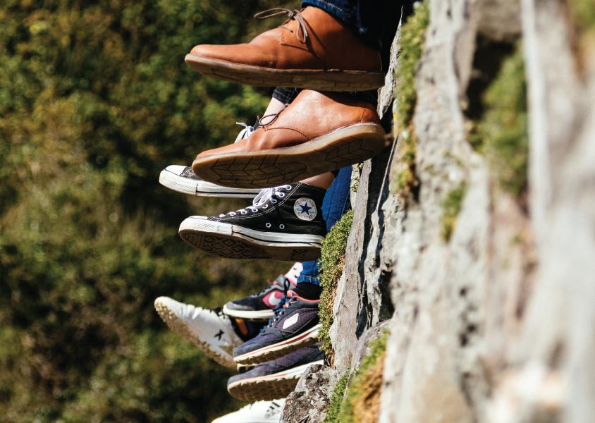 Shoes hang over a ledge