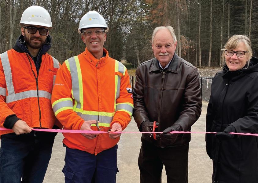 FortisBC and Vernon staff cut a ceremonial ribbon to signify the completion of the Carlson Park fence upgrade