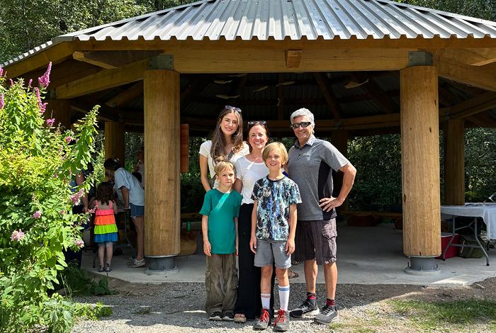 Chloe Finn and Elliot Moses of FortisBC's EGP Project team (left and right) with Valleycliffe Elementary School parent volunteer Raakel Toppila (middle) and her children.