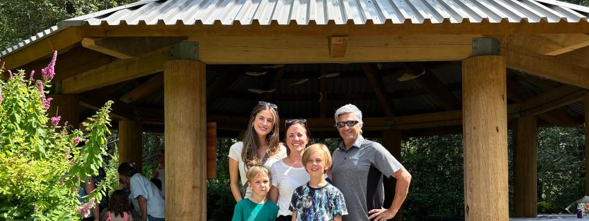 Chloe Finn and Elliot Moses of FortisBC's EGP Project team (left and right) with Valleycliffe Elementary School parent volunteer Raakel Toppila (middle) and her children.