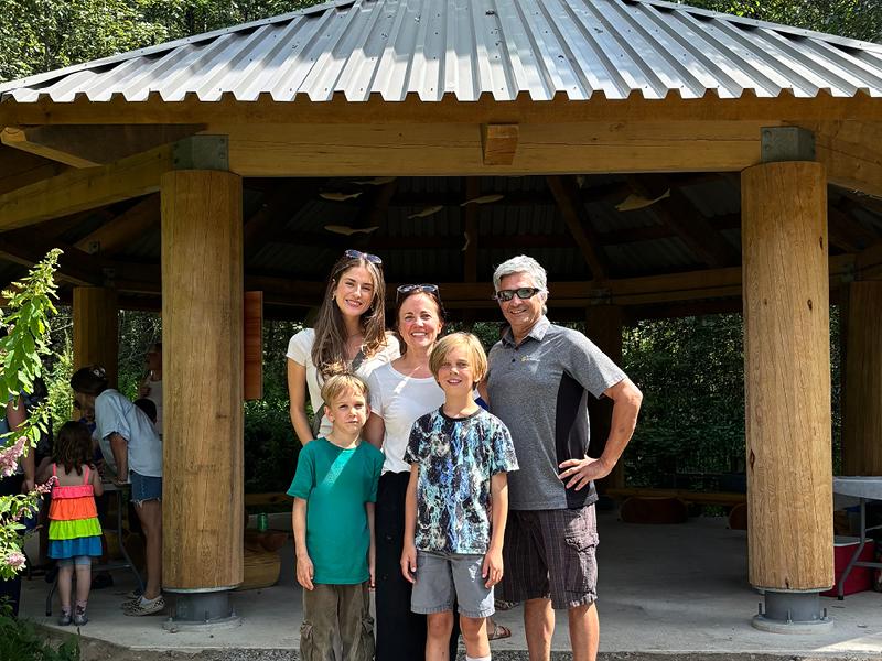 Chloe Finn and Elliot Moses of FortisBC's EGP Project team (left and right) with Valleycliffe Elementary School parent volunteer Raakel Toppila (middle) and her children.