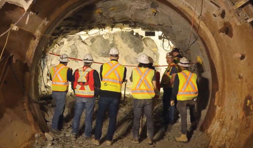 The tunnel team watching the breakthrough.