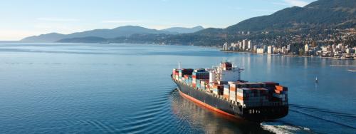 LNG cargo ship sails west through Vancouver's harbour 