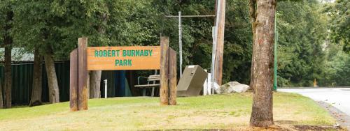 Robert Burnaby Park wooden sign at park entrance