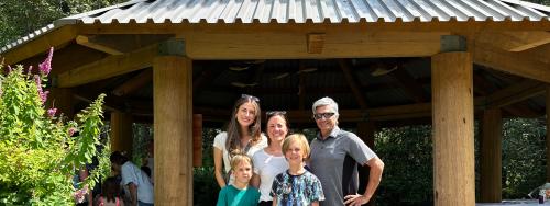 Chloe Finn and Elliot Moses of FortisBC's EGP Project team (left and right) with Valleycliffe Elementary School parent volunteer Raakel Toppila (middle) and her children.